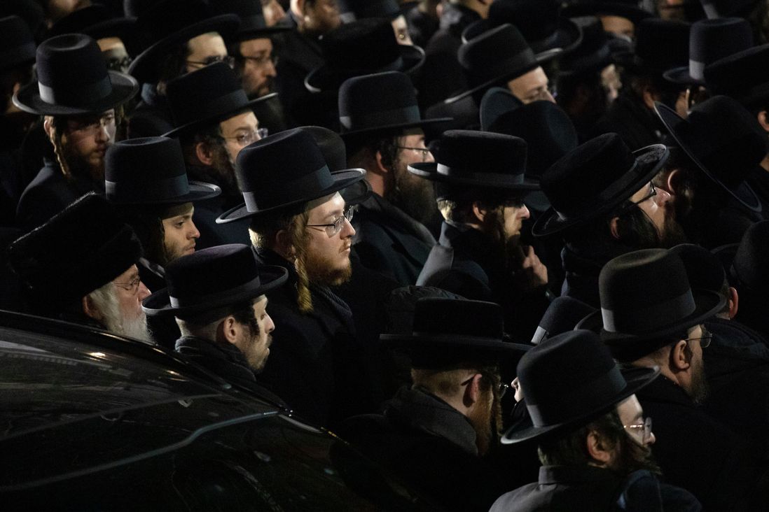 Orthodox Jewish men attend Moshe Deutsch's funeral, in the Williamsburg neighborhood of New York.
